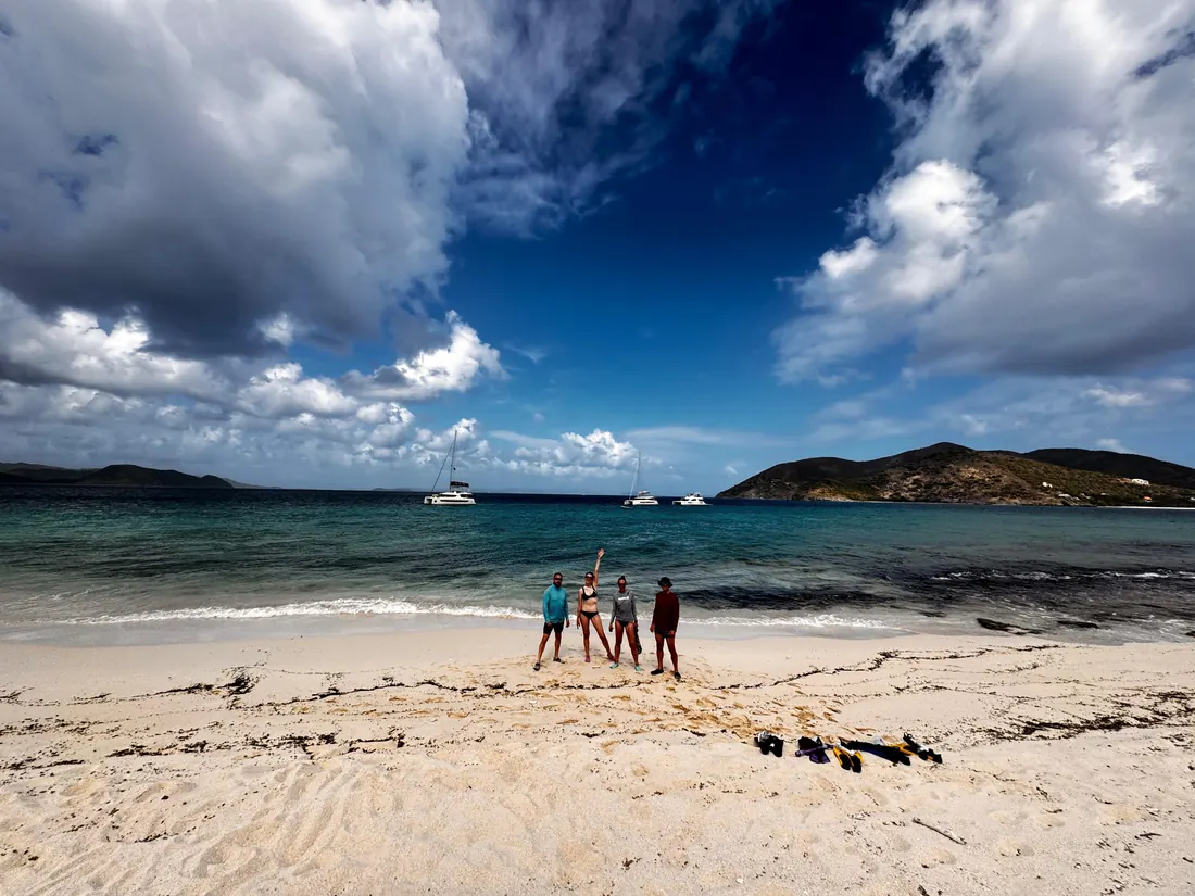 White-sand beach under a big Caribbean sky