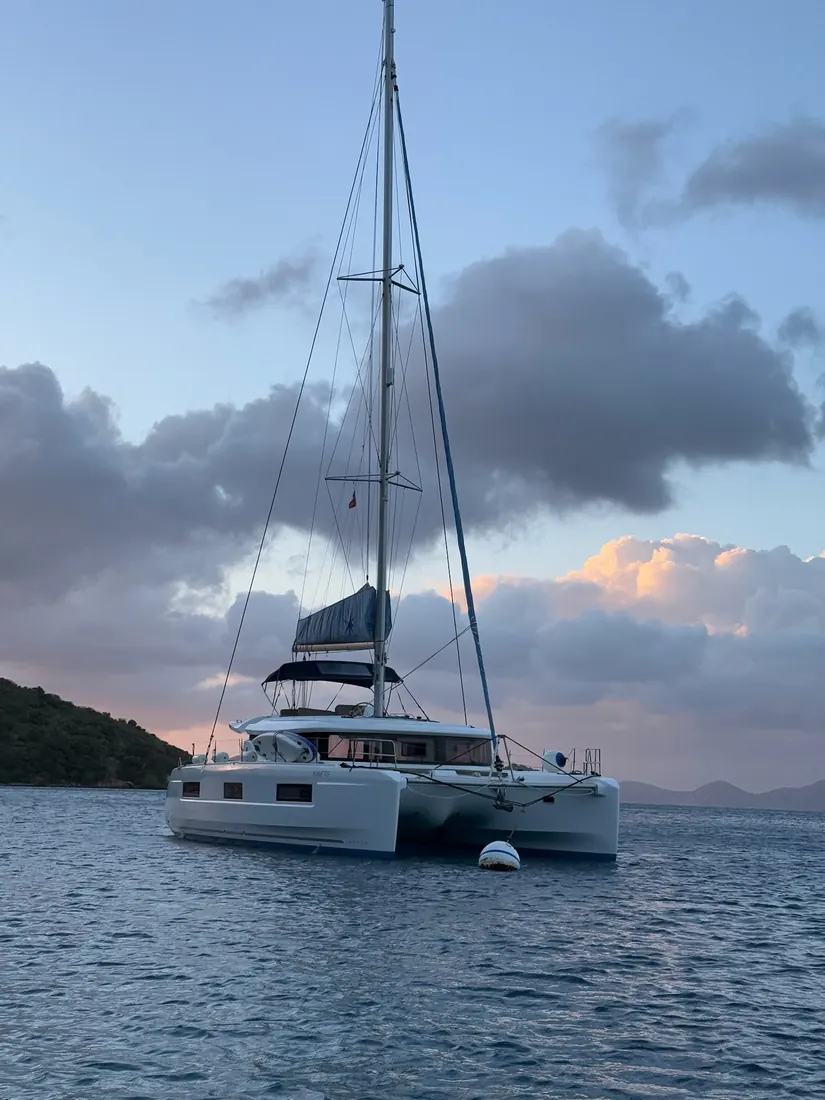 Catamaran at anchor at dusk