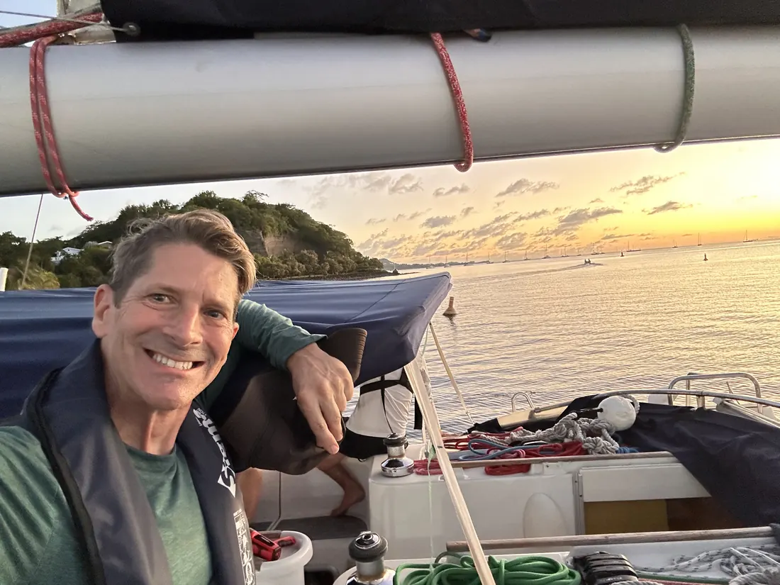 Robert smiling aboard at sunset
